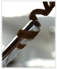 Hair wrapped around curling iron.